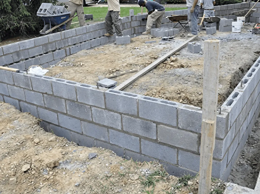 Professionals building a foundation with blocks in Portland, OR